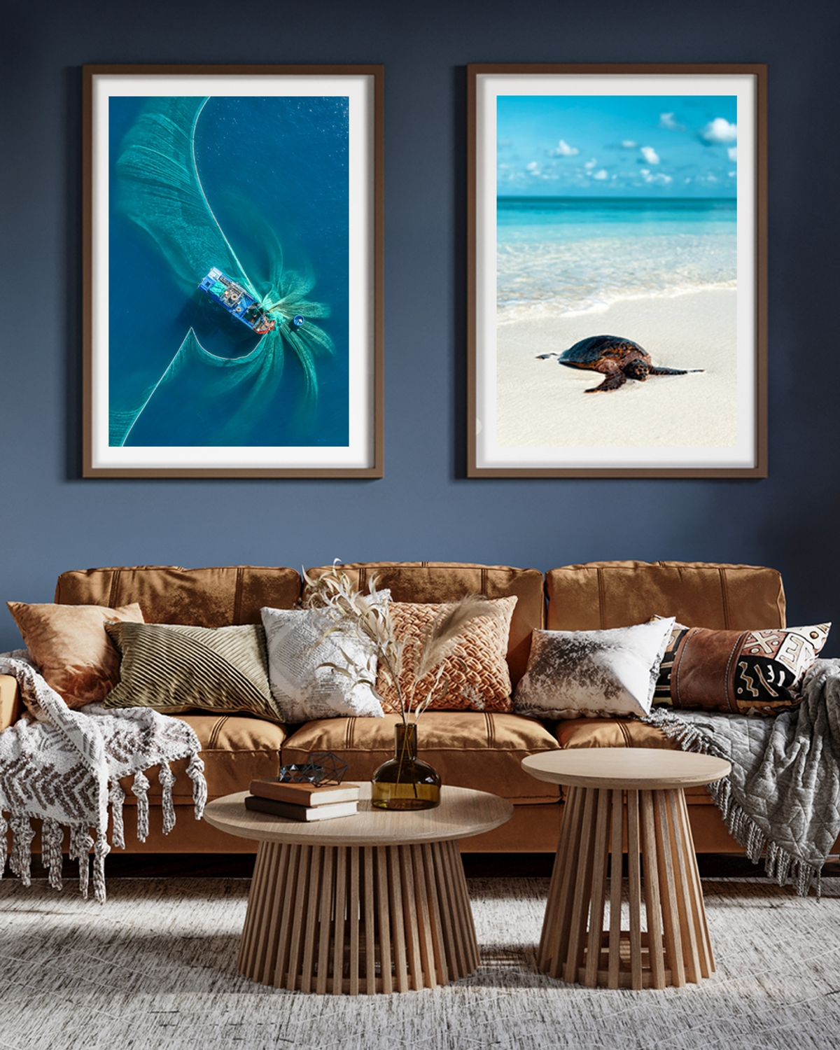 Two framed posters hanged in the living room over and orange soffa