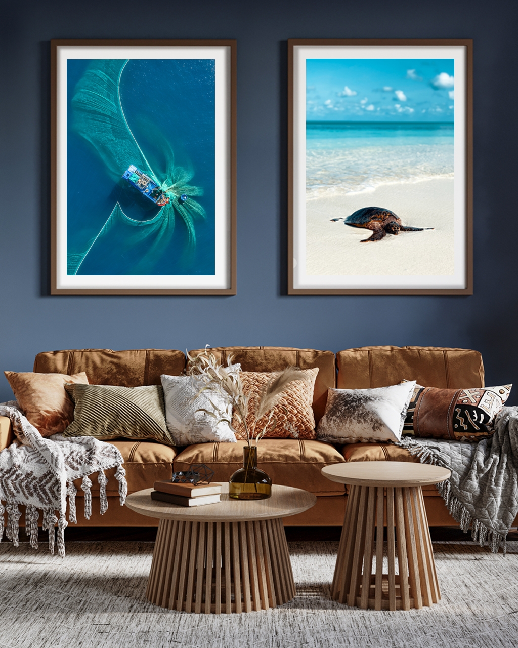 Two framed posters hanged in the living room over and orange soffa