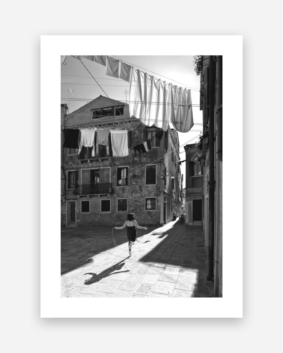 Skipping Through Sunlight poster with a white border, unframed on a light gray background