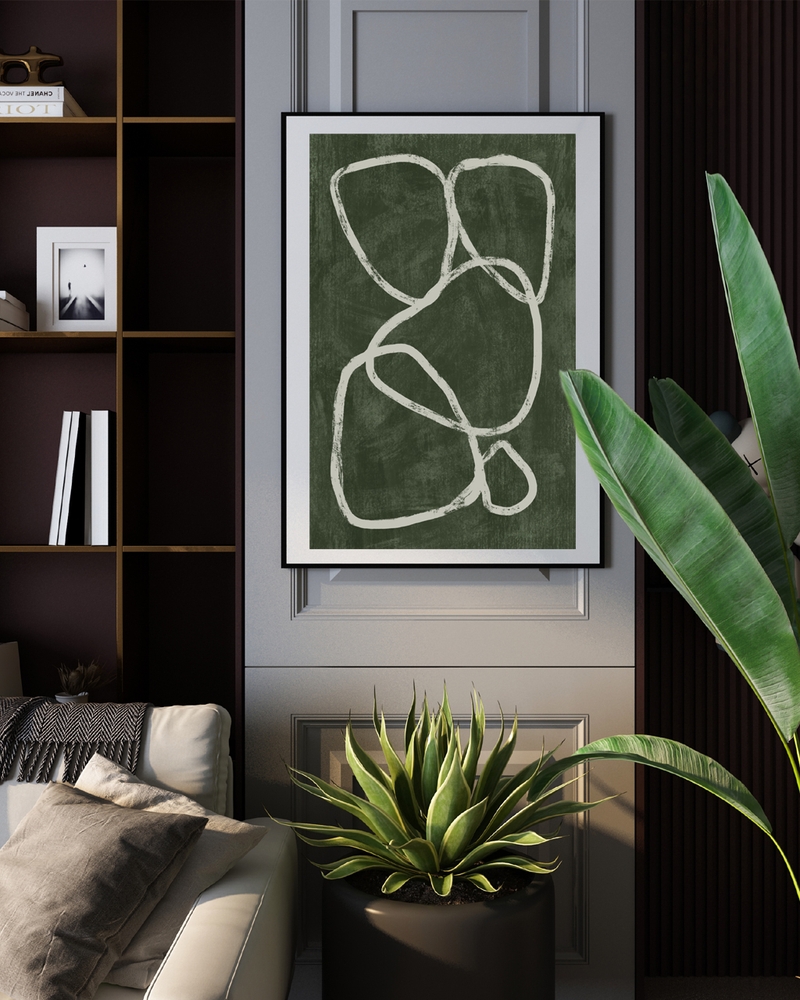 A framed poster of a green background with white lines hanged in the living room