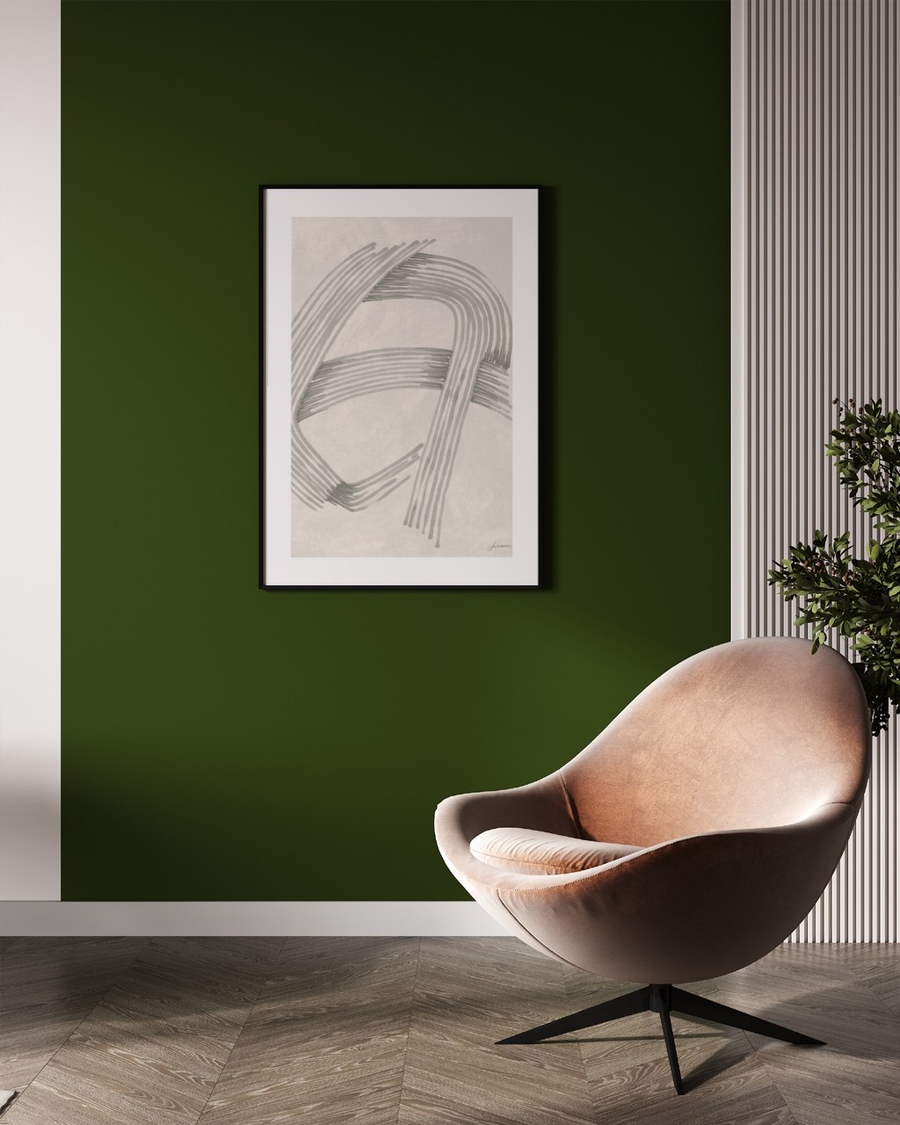 Combed Curves poster in a slim black frame on a deep green wall above a leather lounge chair