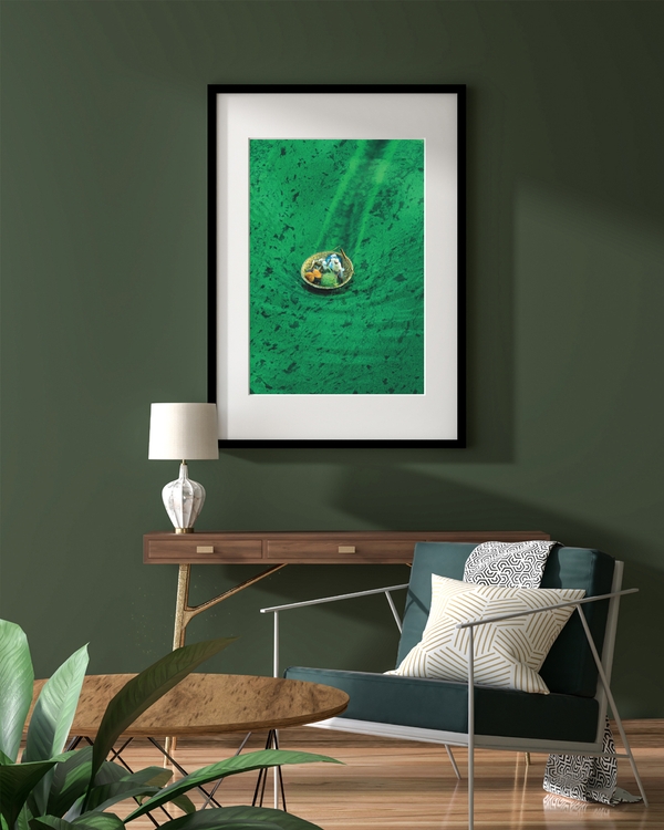 A poster of a Small boat floating in clear green water