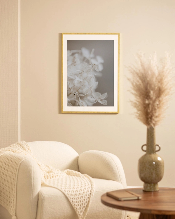 Dried hydrangea petals poster hanged on a beige wall