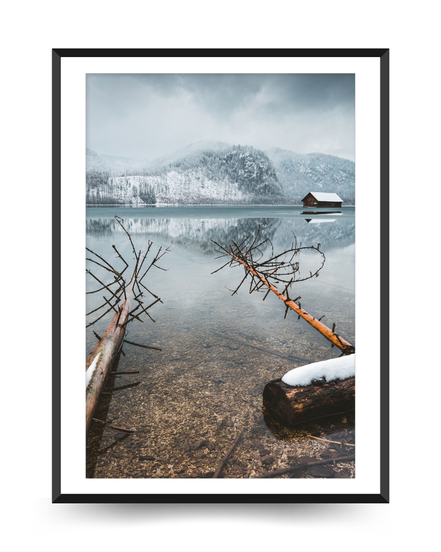 A poster of a Snowy mountains reflected in calm winter lake