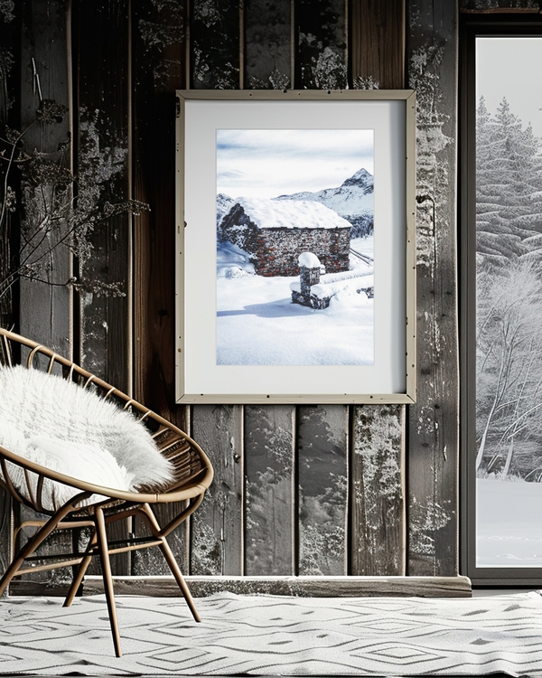 A poster of a Stone cabin surrounded by snow and mountains