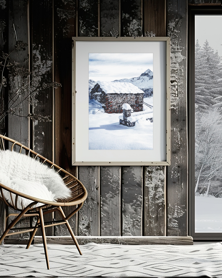 A poster of a Stone cabin surrounded by snow and mountains