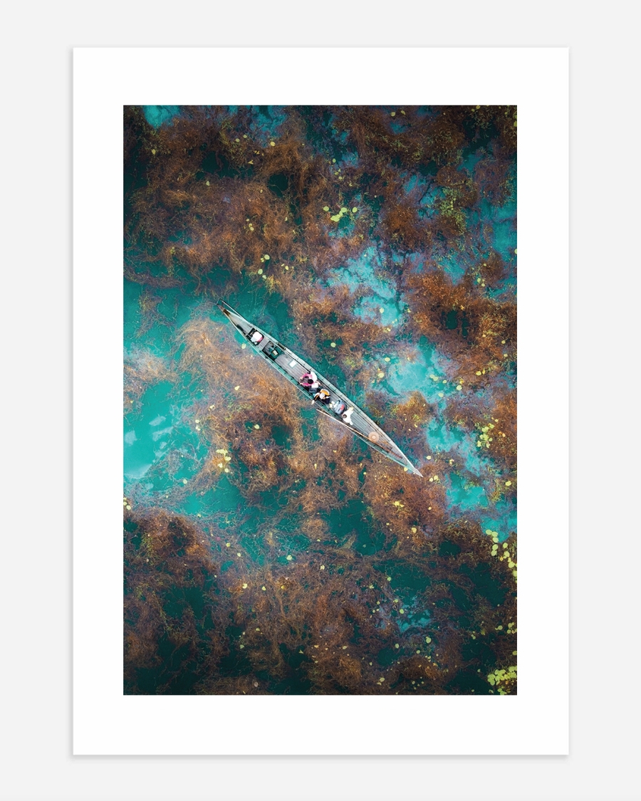 A poster of a Boat seen from above on turquoise water