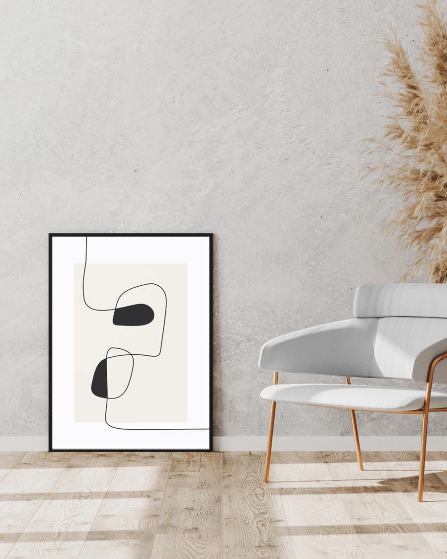 A poster of wiggly lines placed on the floor next to a chair