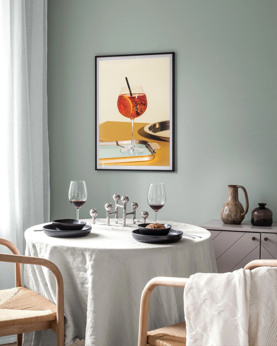 A poster of a Orange cocktail in wine glass on tray