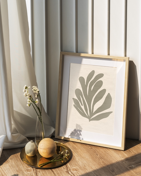 A poster of a Abstract organic leaf shape in muted green beige