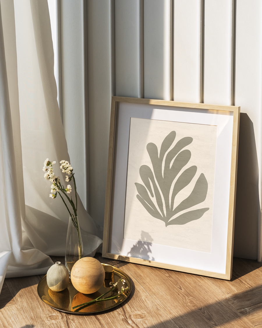 A poster of a Abstract organic leaf shape in muted green beige