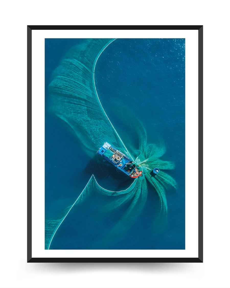 A poster of a Aerial boat creating swirling patterns in blue water