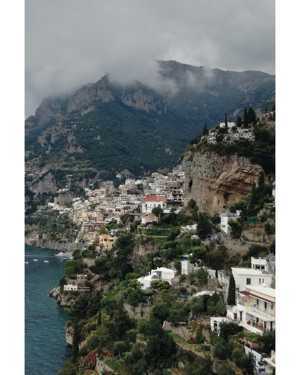 Cliffside coastal town overlooking deep blue sea
