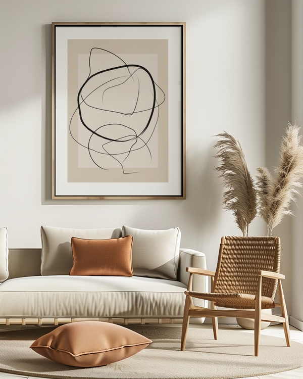 Drifting Ink Curves poster in a slim light wood frame above a cream sofa in a sunlit living room
