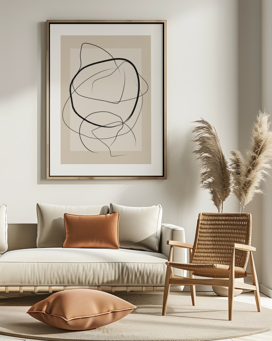 Drifting Ink Curves poster in a slim light wood frame above a cream sofa in a sunlit living room