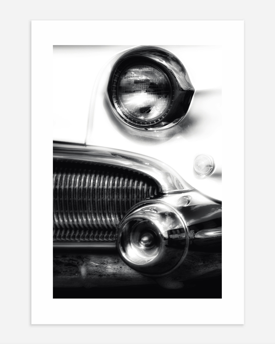 A poster of a Black and white close up of classic car front