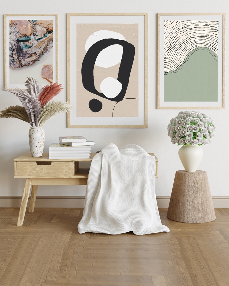 A poster of a Abstract black shapes with white circles on beige background