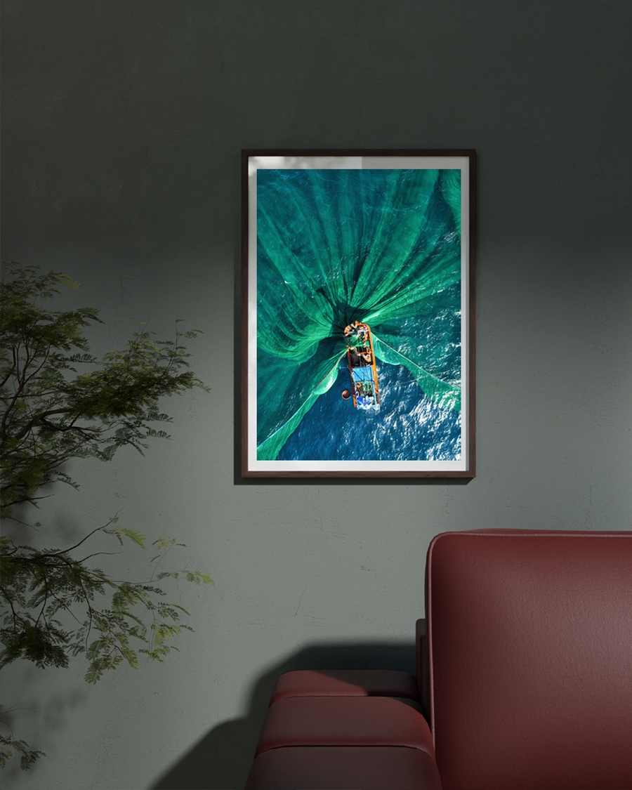 A poster of a Aerial view of fishing boat with green nets spread