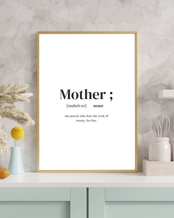A poster of the definition of the word Mother placed on a light blue table