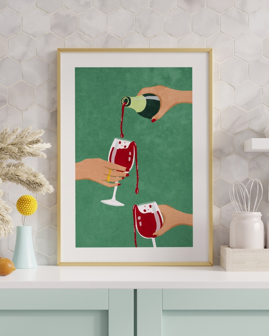 Generous Pour poster in a slim gold frame on a white counter against hexagonal tiles