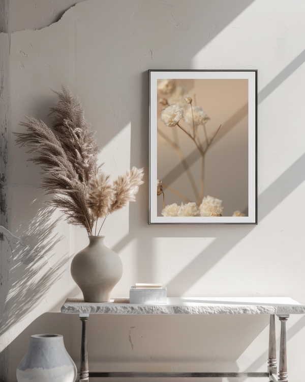 A poster of a close-up of dried flowers in soft beige tones