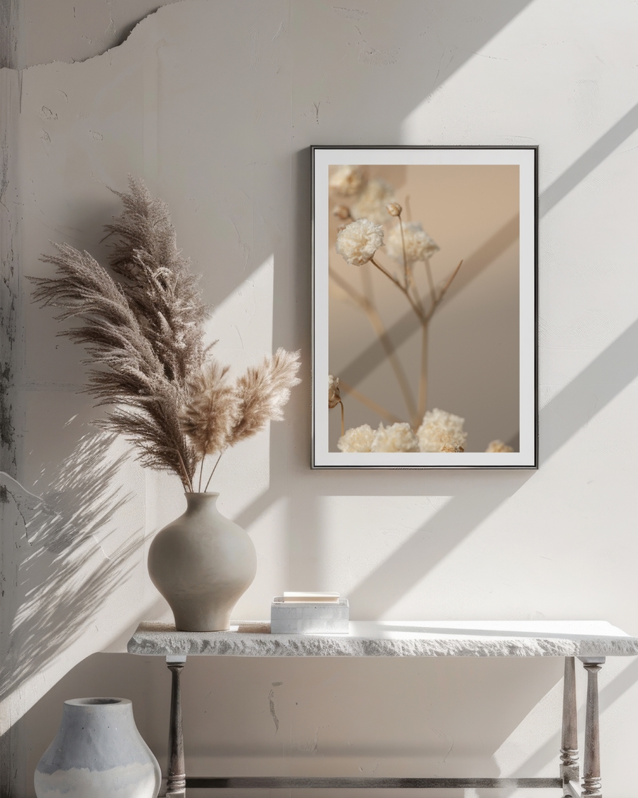 A poster of a close-up of dried flowers in soft beige tones