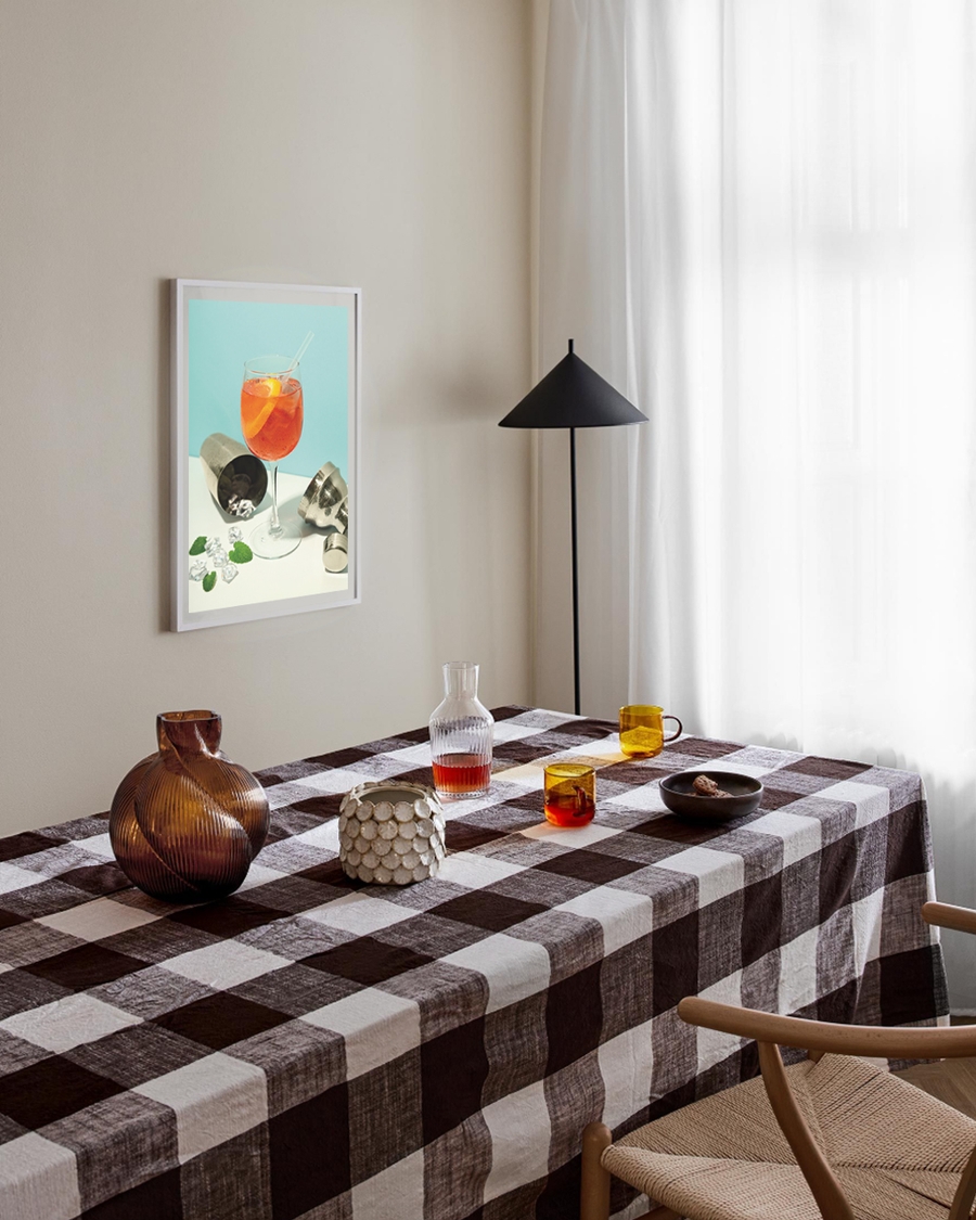 A poster of a Orange cocktail with ice cubes and citrus peel