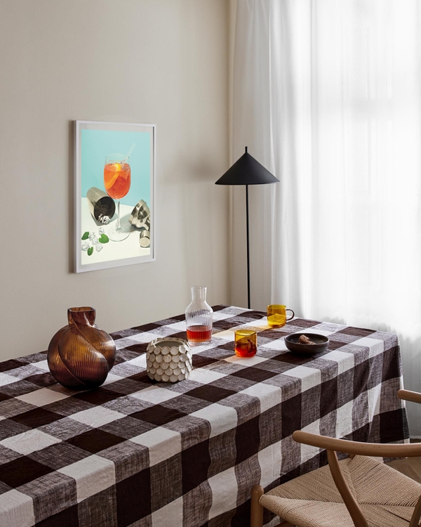 A poster of a Orange cocktail with ice cubes and citrus peel