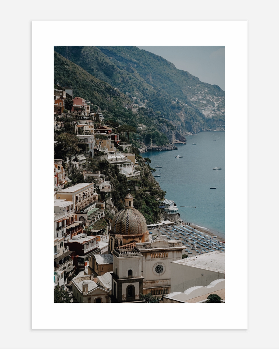 A poster of a Historic coastal city with domed building by sea
