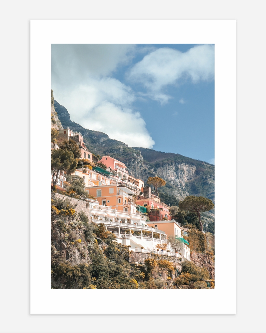A poster of a Coastal houses on cliffs under clear sky