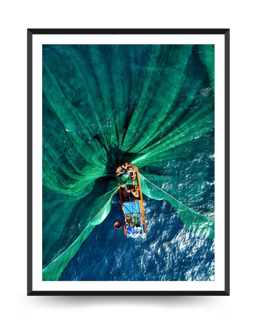 A poster of a Aerial view of fishing boat with green nets spread