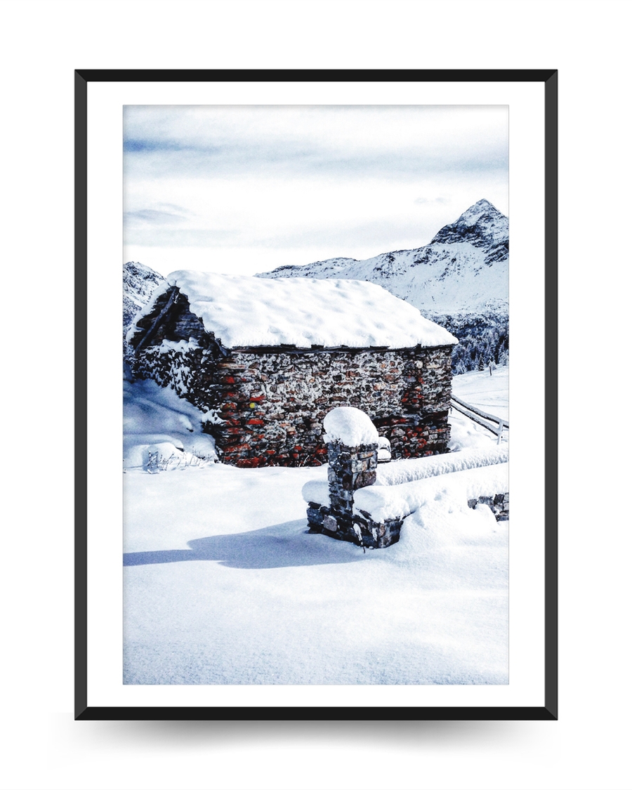 A poster of a Stone cabin surrounded by snow and mountains