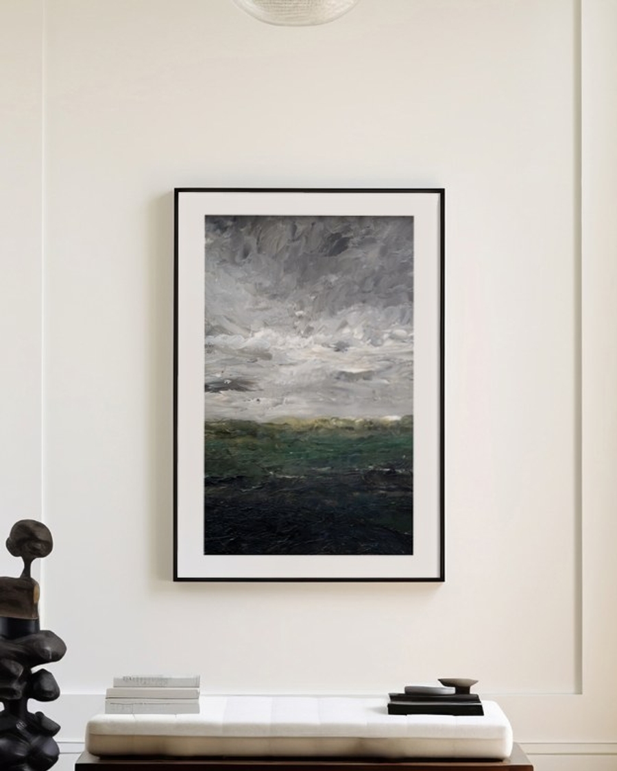 Clouded Heath poster in a slim black frame above a wooden bench in a bright entryway
