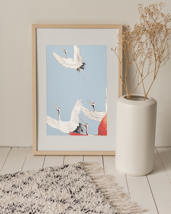 A poster of a Japandi art with flying cranes on blue background
