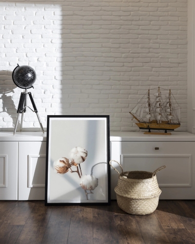 A poster of a Cotton branches with soft light on neutral background