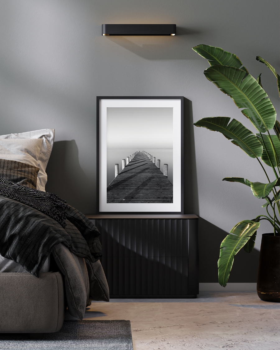 A poster of a Symmetrical wooden pier leading into calm water