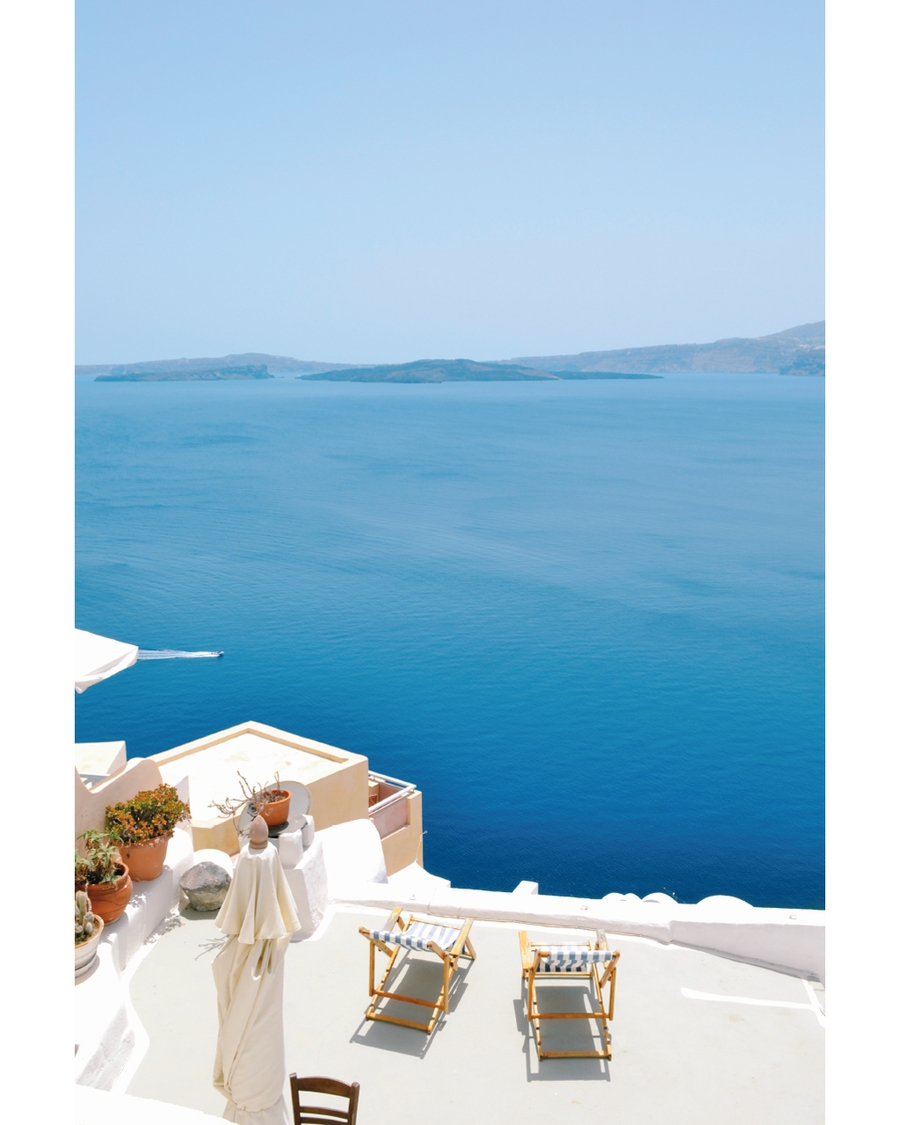 White terrace overlooking deep blue sea