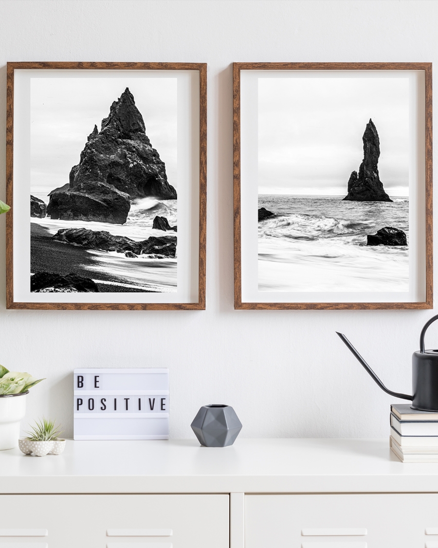 A poster of a Black and white photo of rugged sea rock