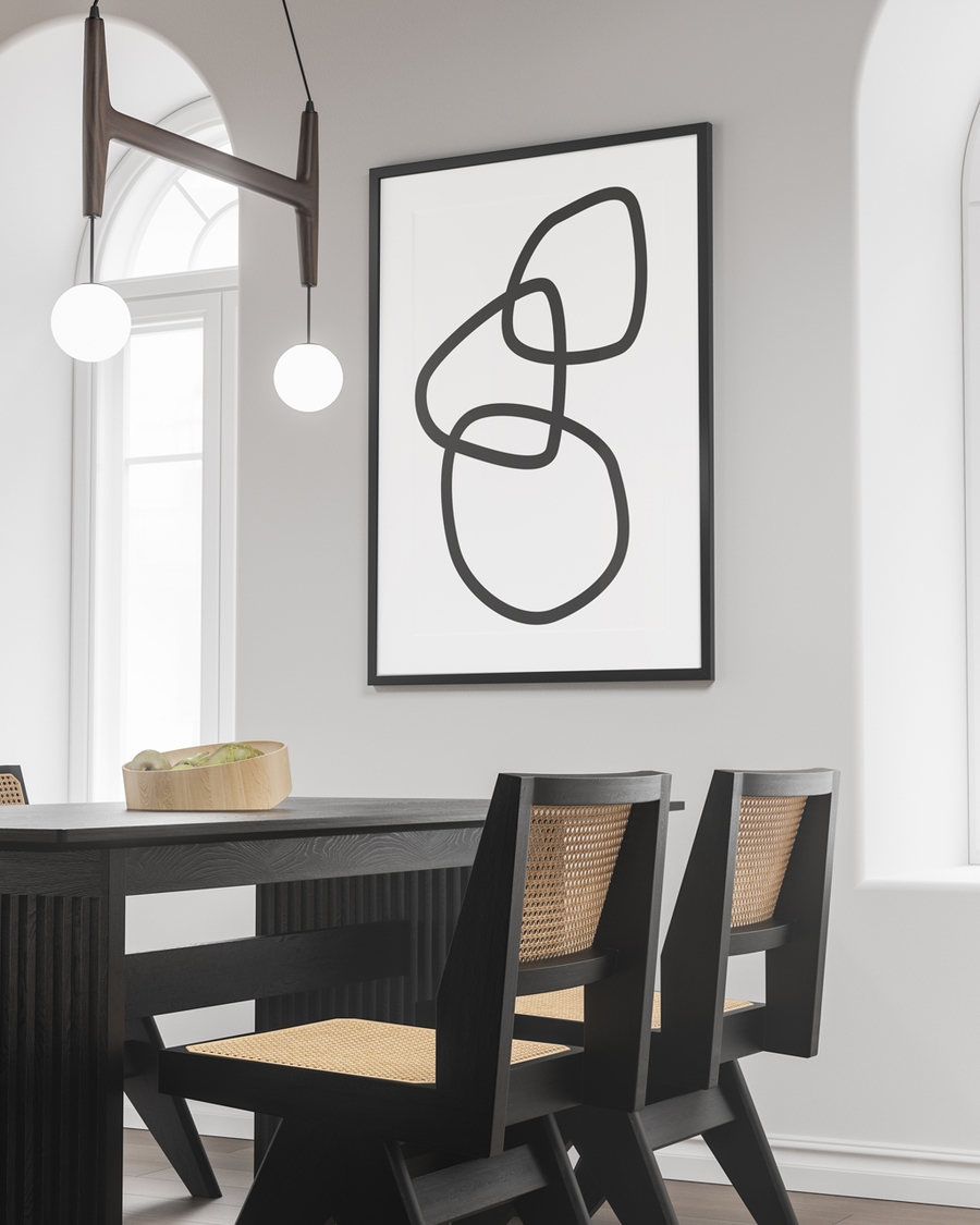 A poster of 3 random rings on a white background hanged in an office