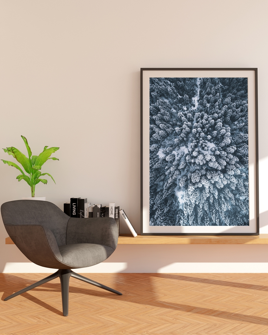 A poster of a Snow covered forest seen from above in winter