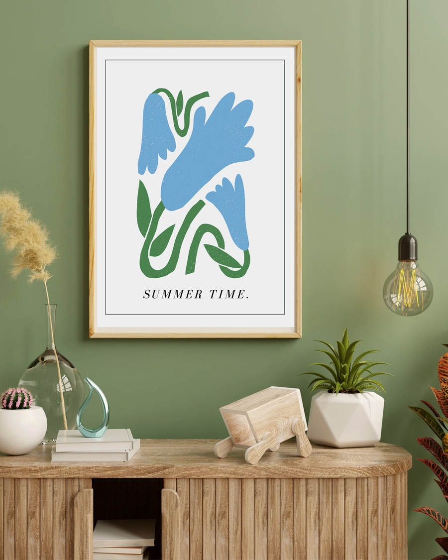 A poster of an abstract floral hanged on a green wall over a brown table