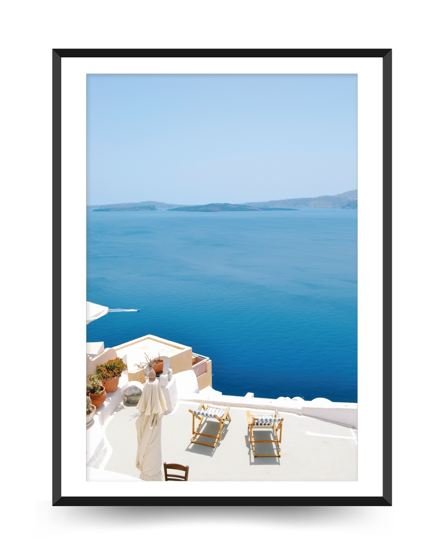 A poster of a White terrace overlooking deep blue sea