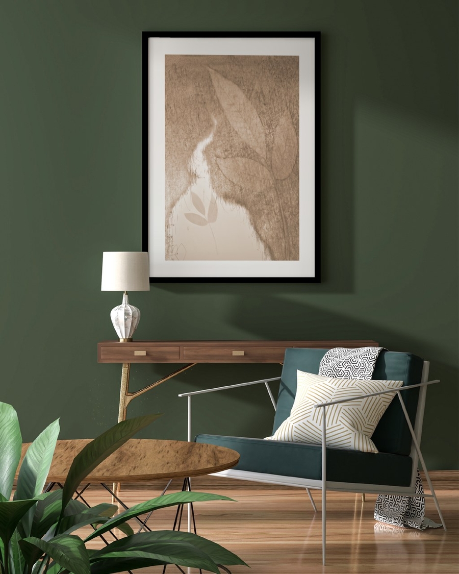 Sepia Leaf Veil poster in a black frame on a deep green wall above a walnut console table