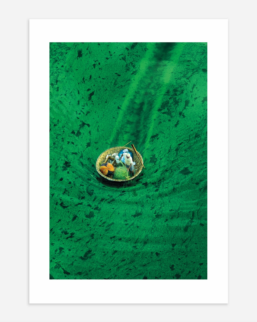 A poster of a Small boat floating in clear green water