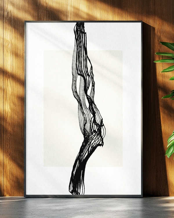 A poster of a black tree branch on a beige background laying on the ground