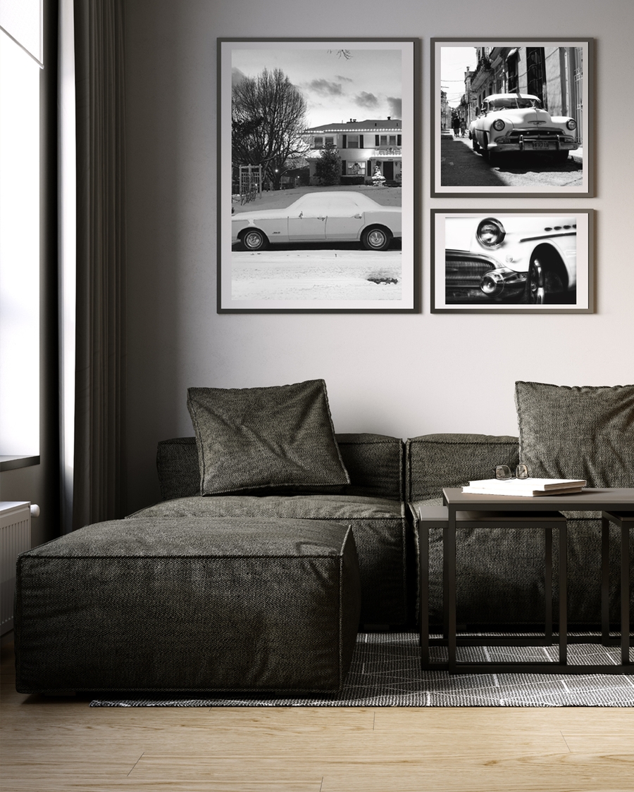 A poster of a classic car covered in snow in front house