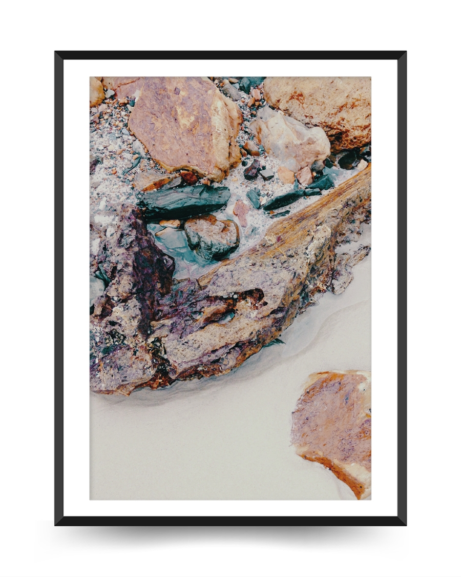 A poster of a Layered stones and sand textures in earthy muted tones