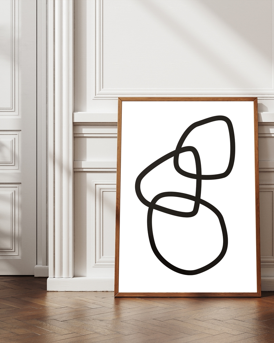 A poster of three random black rings placed on the ground