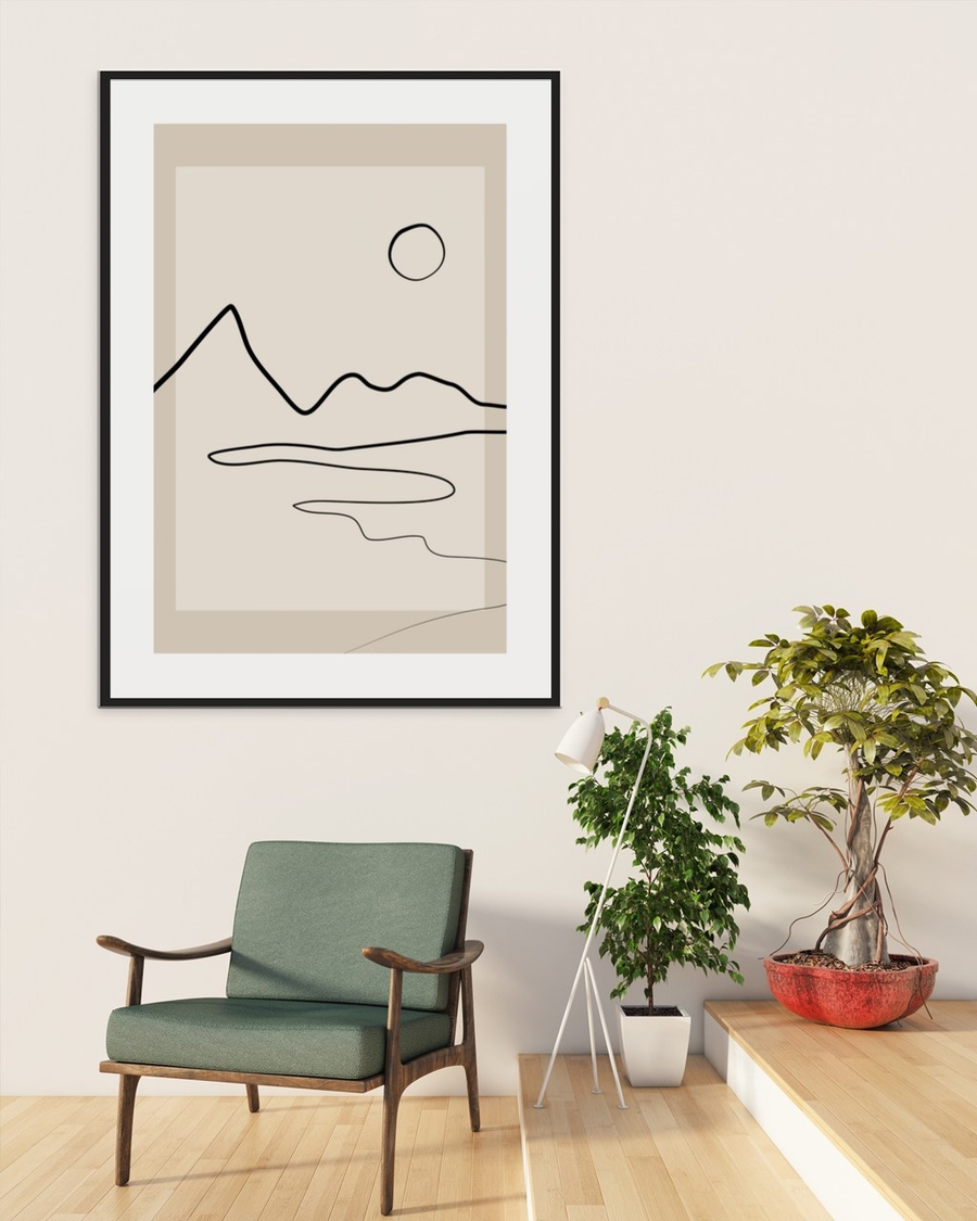 Line Drawn Valley poster in a black frame with white mat above a green armchair in a bright minimal room