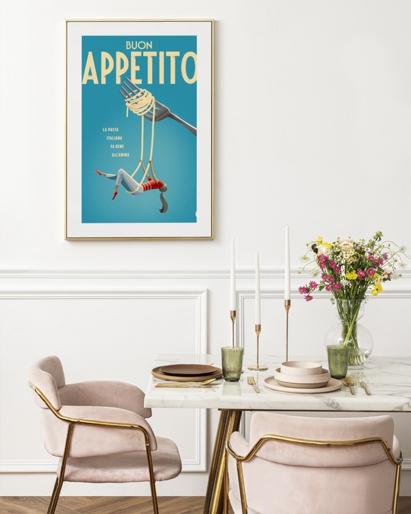 Pasta Swing poster in a slim gold frame above a marble dining table with pink velvet chairs